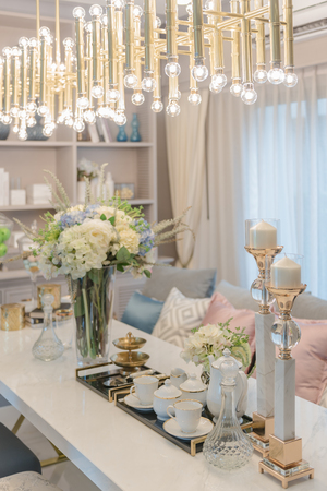 luxury table set on dinnig table with vase of flower in dining room interior designの写真素材