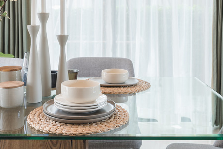 glass dining table with table set in modern dining room interior design conceptの写真素材