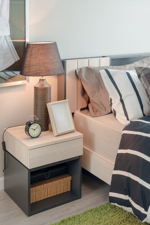 modern bedroom design with black and white blanket and set of pillowsの写真素材