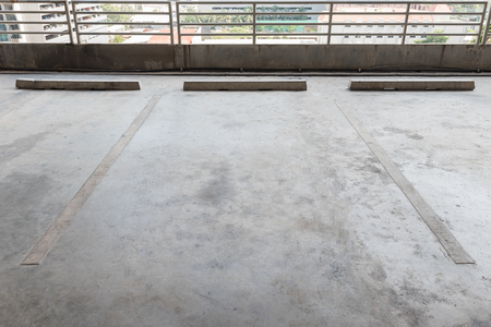 interior of parking garage with car and vacant parking lot in parking buildingの写真素材
