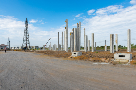 consruction site with  precast concret pile and pile-driver, prefabrication house structure designの写真素材