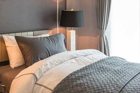 single bed with black lamp in classic style bedroom, interior design conceptの写真素材