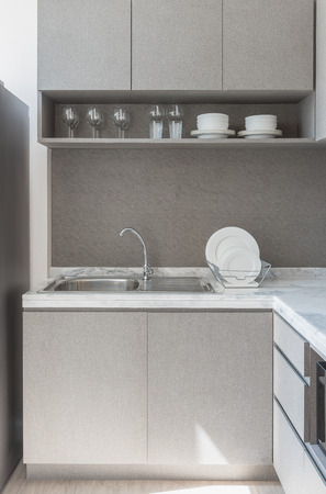 modern kitchen room with sink on granite counter top, interior design conceptの写真素材