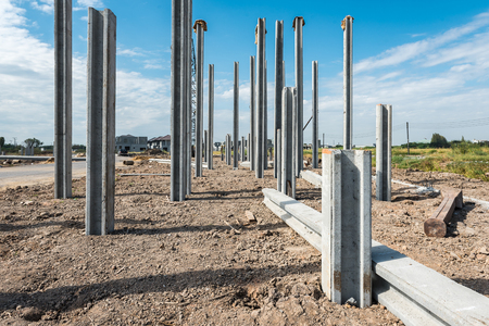 consruction site with  precast concret pile and pile-driver, prefabrication house structure designの写真素材