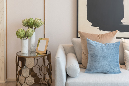 modern living room with set of pillows on sofa, interior design concept