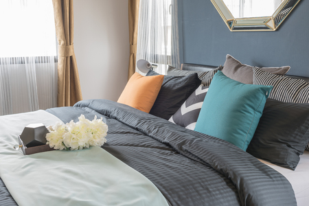 tray of flower on modern bed in modern bedroom, interior design conceptの写真素材