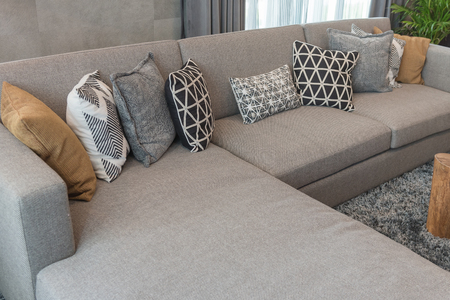 luxury living room style with set of pillows on classic sofa, interior design concept