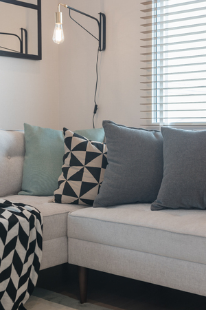 modern living room with set of pillows on sofa; interior design conceptの写真素材