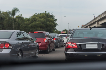traffic jam with row of cars on toll way, rush hour