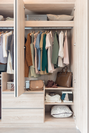 wooden closet with colorful clothes, modern closet interior design conceptの写真素材