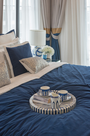 luxury bedroom in indigo blue tone with set of tea cup on wooden tray, interior design decoration conceptの写真素材