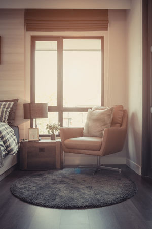 modern bedroom with set of sofa and table side on carpet, interior decoration design concept, vintage style processの写真素材