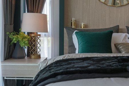 modern bedroom with set of pillows on classic bed, interior decoration design conceptの写真素材