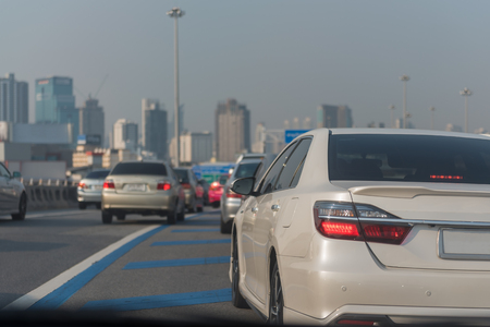 traffic jam on main street with row of cars in downtown, central businees districの写真素材