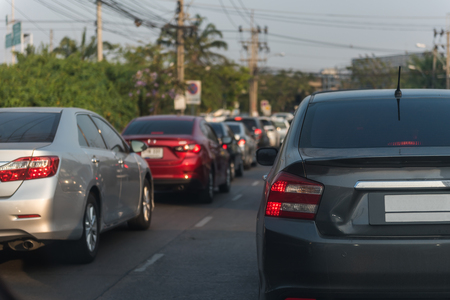 traffic jam on main street with row of cars in downtown, central businees districの写真素材