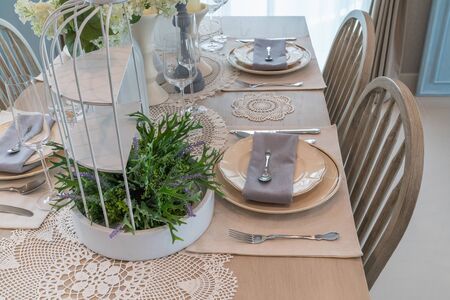 modern dining room with wooden table and chair, interior design concept decorationの写真素材
