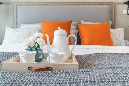 classic bedroom style with set of tea cup on wooden plate, interior design concept decorationの写真素材