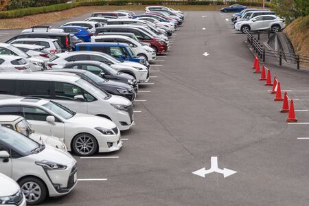 row of cars parked in outdoor parking lot, out door parking with lot of carsの写真素材