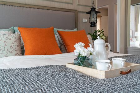 classic bedroom style with set of tea cup on wooden plate, interior design concept decorationの写真素材