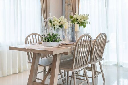 modern dining room with wooden table and chair, interior design concept decorationの写真素材
