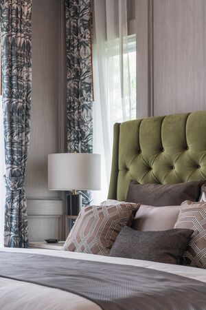 classic bedroom style with set of pillows on bed, interior design concept decorationの写真素材