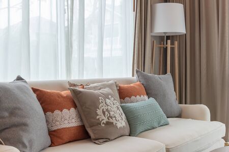 classic living room with set of pillows on white sofa, interior design decoration conceptの写真素材