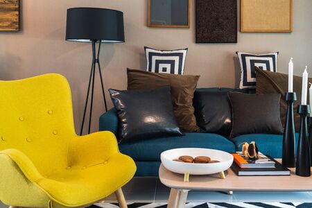 modern living room with set of pillows and cushions on sofa, interior design concept decorationの写真素材