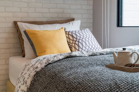 modern bedroom with set of pillows on bed, interior design concept decorationの写真素材