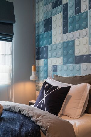 modern bedroom with set of pillows on bed, interior design concept decorationの写真素材