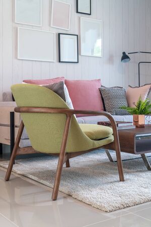 modern living room with set of pillows and cushions on sofa, interior design concept decorationの写真素材