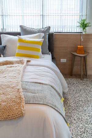 modern bedroom with set of pillows on bed, interior design concept decorationの写真素材