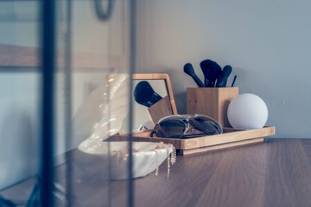 women's accessories on wooden dressing table, interior design concept decoration, vintage style imageの写真素材