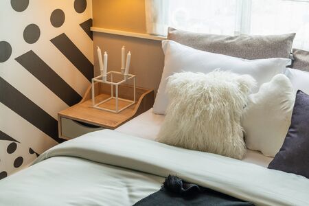 modern bedroom with set of pillows on bed, interior design concept decorationの写真素材