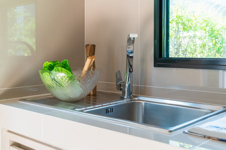 modern kitchen room with sink on counter, interior design decoration conceptの写真素材