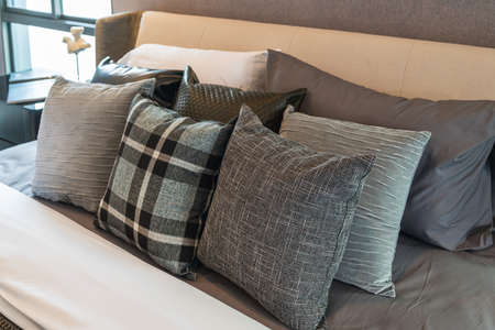 modern bedroom style with set of pillows on bed, interior design concept decorationの写真素材