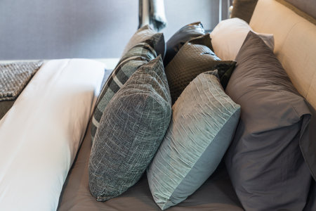 modern bedroom style with set of pillows on bed, interior design concept decorationの写真素材