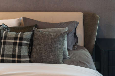 modern bedroom style with set of pillows on bed, interior design concept decorationの写真素材