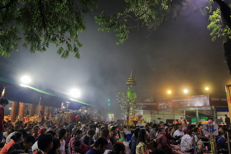 The crowd waited for morning prayer on the khao khitchakut mountain at night and fog of Thailand.のeditorial素材
