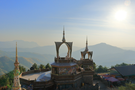 Pha Sorn Kaew temple on the mountains with sunshine and blue skyの写真素材