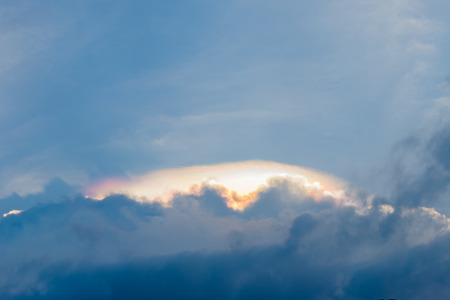 colors in cloud on the sky and light shining down with clouds atmosphere effect.の写真素材