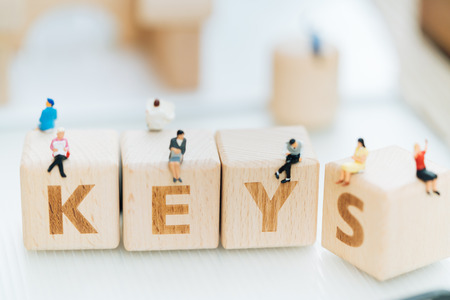 Wood block word KEYS and business man with copy space using as background Choice of the best suited employee, HR, HRM, HRD, job recruiter concepts.の写真素材