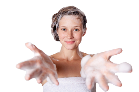 Beautiful woman taking a shower and shampooing her hair. washing hair with Shampoo. studio shot isolated on white background.の写真素材