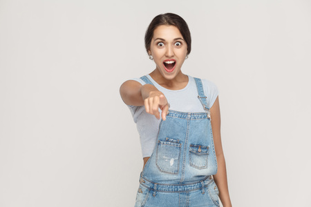 Wow that's great Portrait of young adult caucasian woman with shocked facial expression. Indoor, studio shotの写真素材