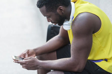 Bodybuilder chatting after hard outdoor training. Outdoor shot, morning. Spring or summer
