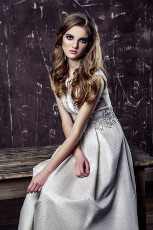 Young model posing in luxury wedding dress, indoor studio shot.の写真素材