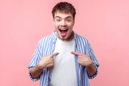 Wow this is me! Portrait of surprised brown-haired man with small beard and mustache in casual...