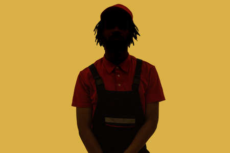 No name, anonymous hiding face in shadow, human identity. Silhouette portrait of male person wearing...