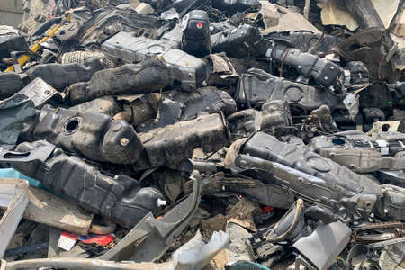 A lot of fuel tanks of broken automobiles, used auto spare parts for reuse, spare parts from damaged...