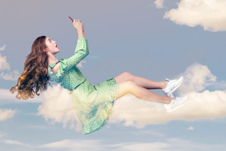Hovering in air. Surprised shocked girl with mobile phone, chatting online in social network amazed...