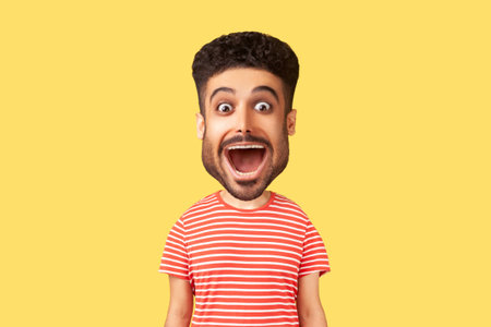 Caricature comic portrait of surprised funny young adult man looking at camera with open mouth and amazed big eyes, expressing astonishment. Indoor studio shot isolated on yellow backgroundの写真素材